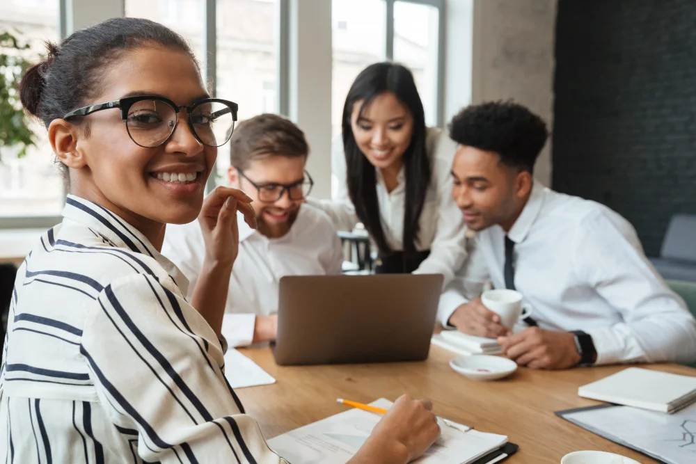 Happy-Young-Business-Colleagues-Indoors Networking To Attract Candidates | Nw Recruiting Partners